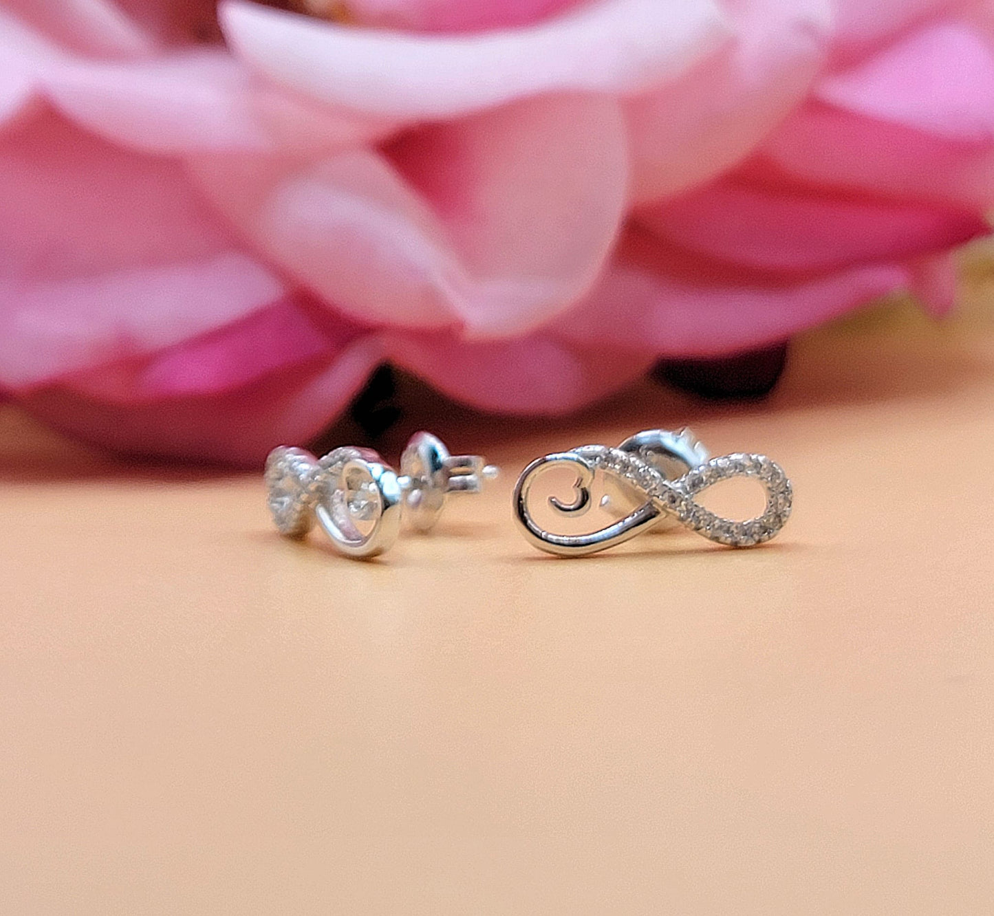 A607 Infinity Half Diamond Accent Post Earrings