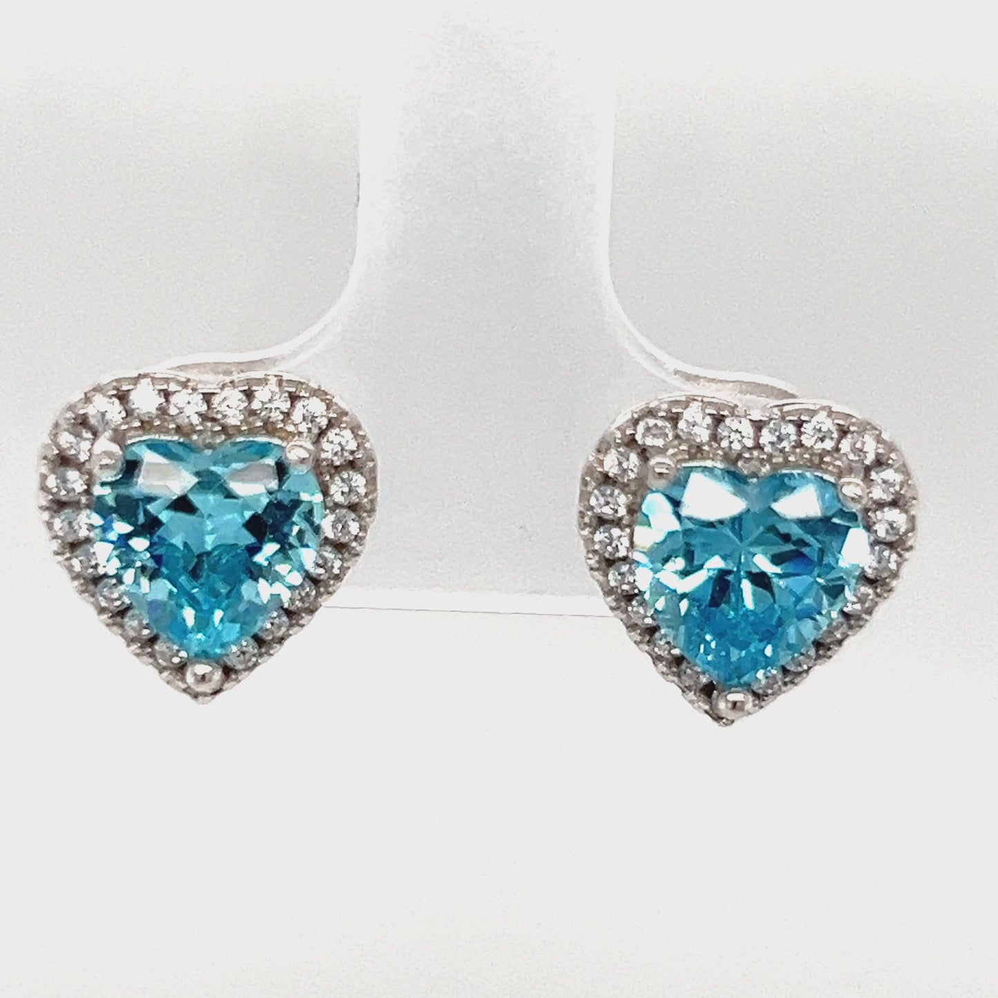 Load and play video in Gallery viewer, A770 Blue Stone with CZ Heart Post Earrings
